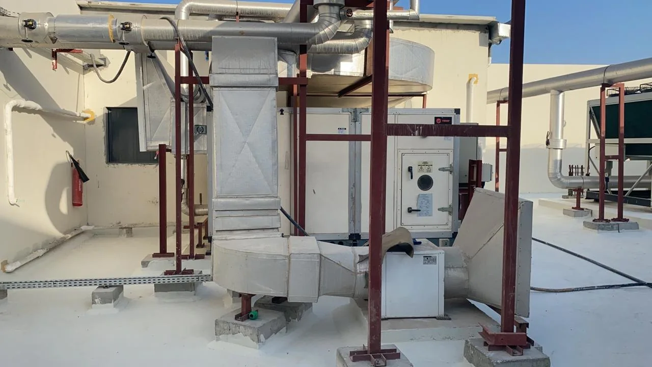 Air handling unit with supply and return ductwork on a rooftop plant area