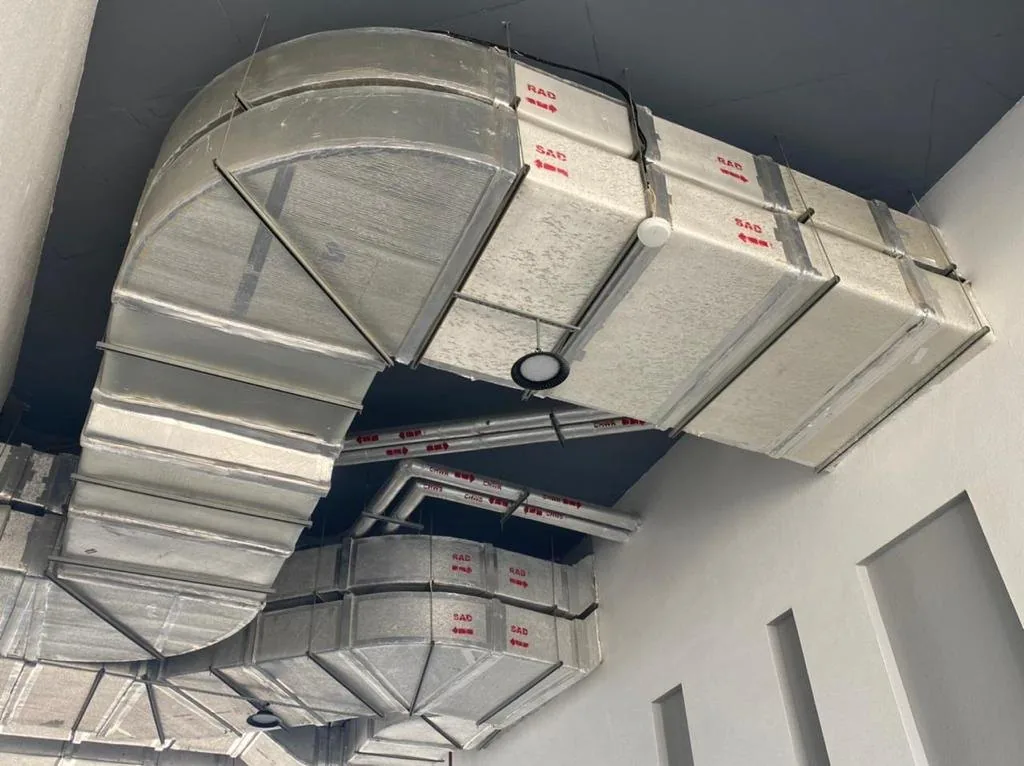 Insulated supply and return air ductwork installed below a ceiling