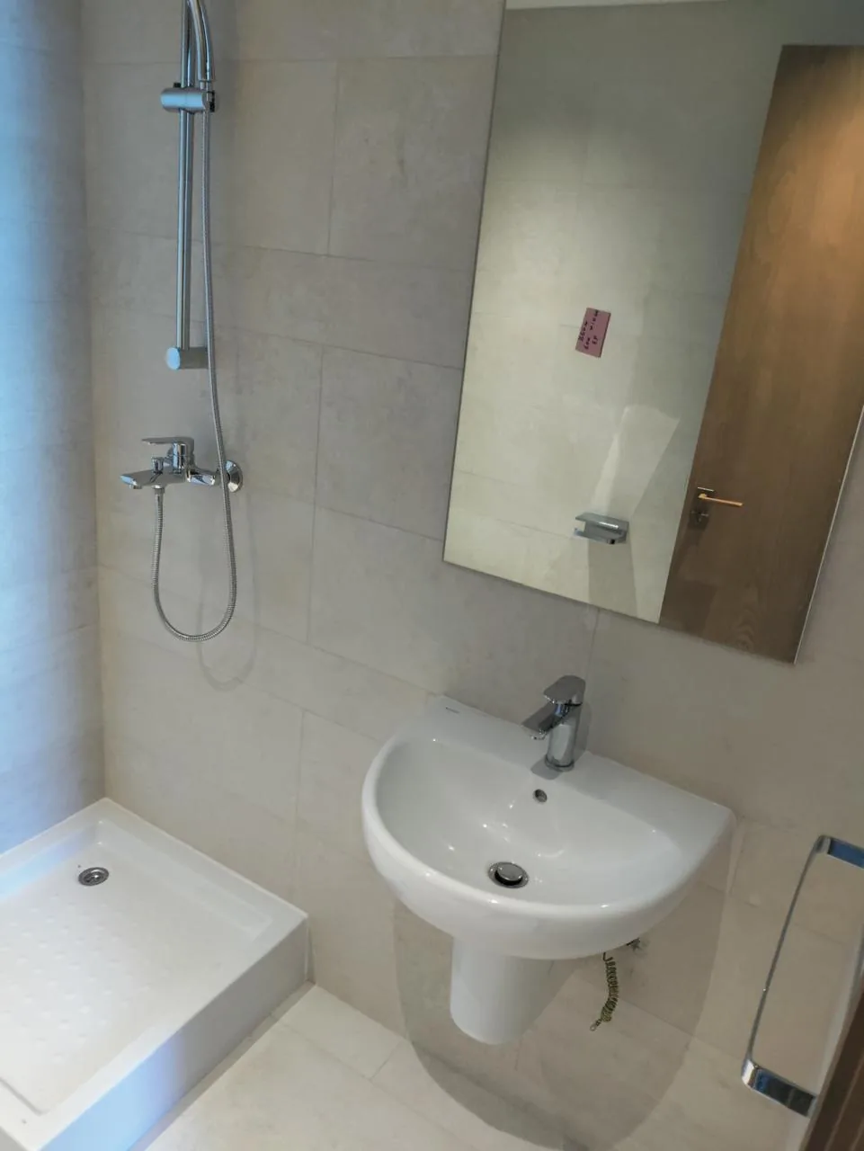 Installed shower, basin and mirror
