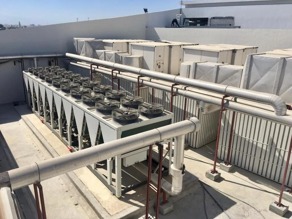 Air-cooled chillers and packaged units on a roof