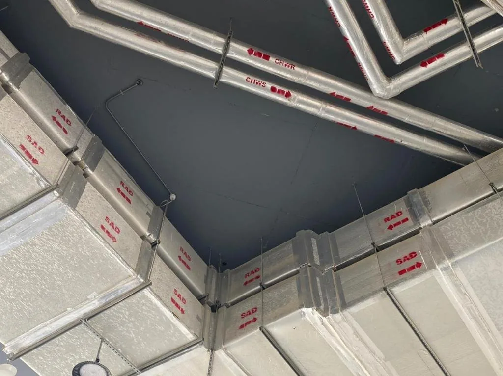 Labelled supply and return air ducts at ceiling level