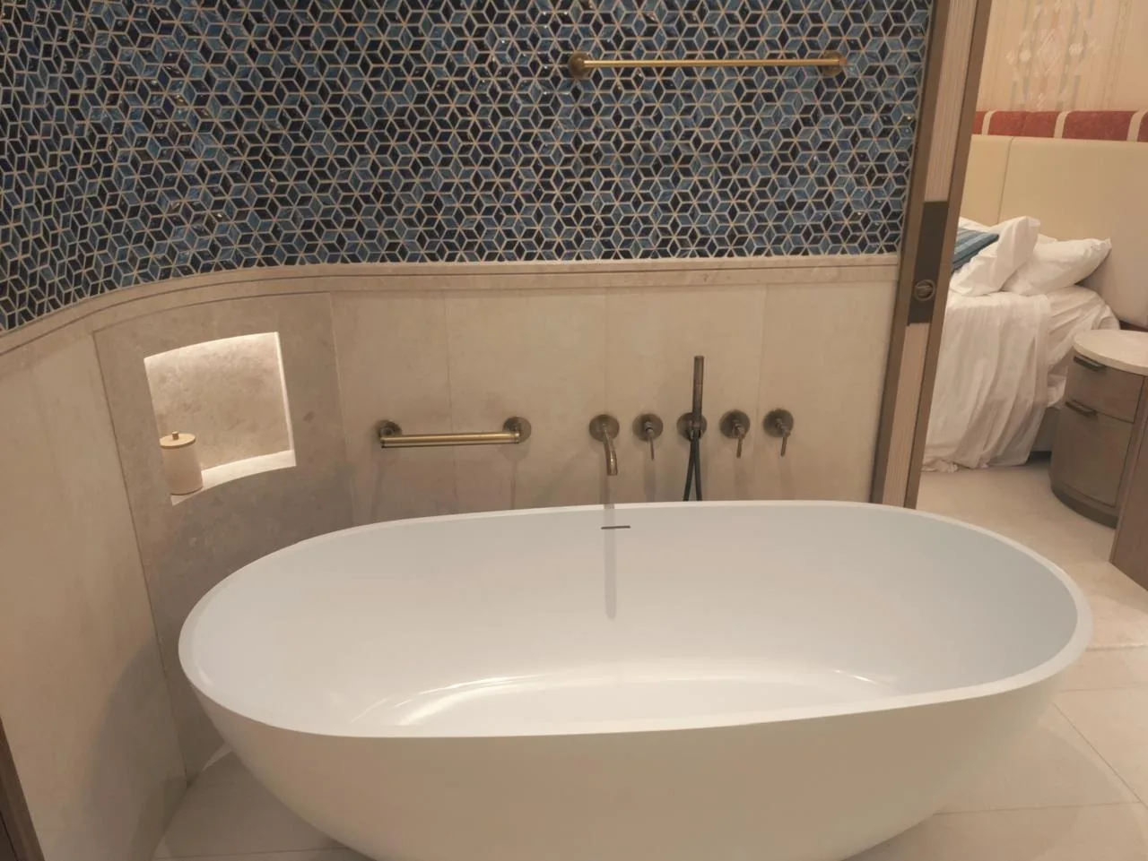 Finished bathroom with freestanding bathtub